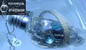 CHRISTMAS ORNAMENT LIGHTBULB LIGHT BULB #29 GOLD AUTHENTIC GENUINE WATCH CLOCK BANDS GREEN PINK PEARLS COLORED LIGHTBULBS CLEAR BEADS MOVEMENTS MISCELLANEOUS STARR WILDE STEAMPUNK FORTRESS